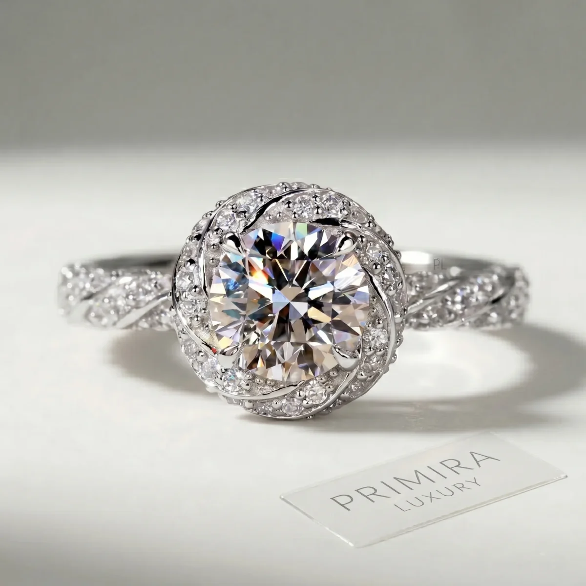 Whispering Twist 1.5 Carat Round White Diamond Halo Ring Online | Primira Luxury