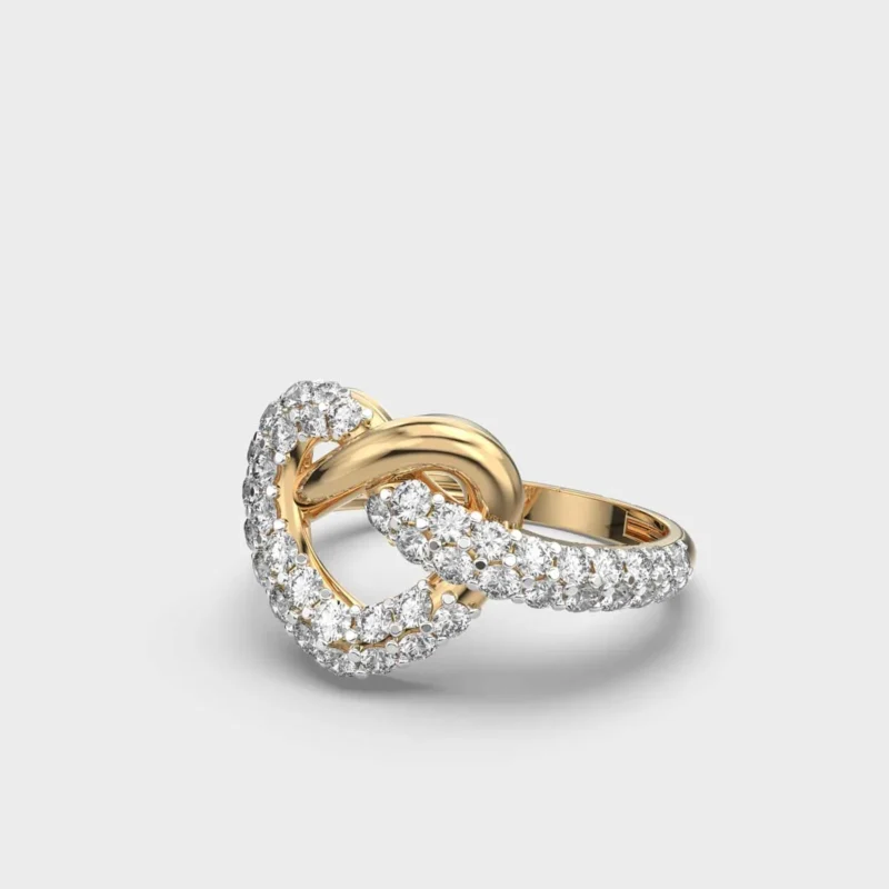 Angled view of yellow gold interlocking heart knot ring with round lab grown diamonds.