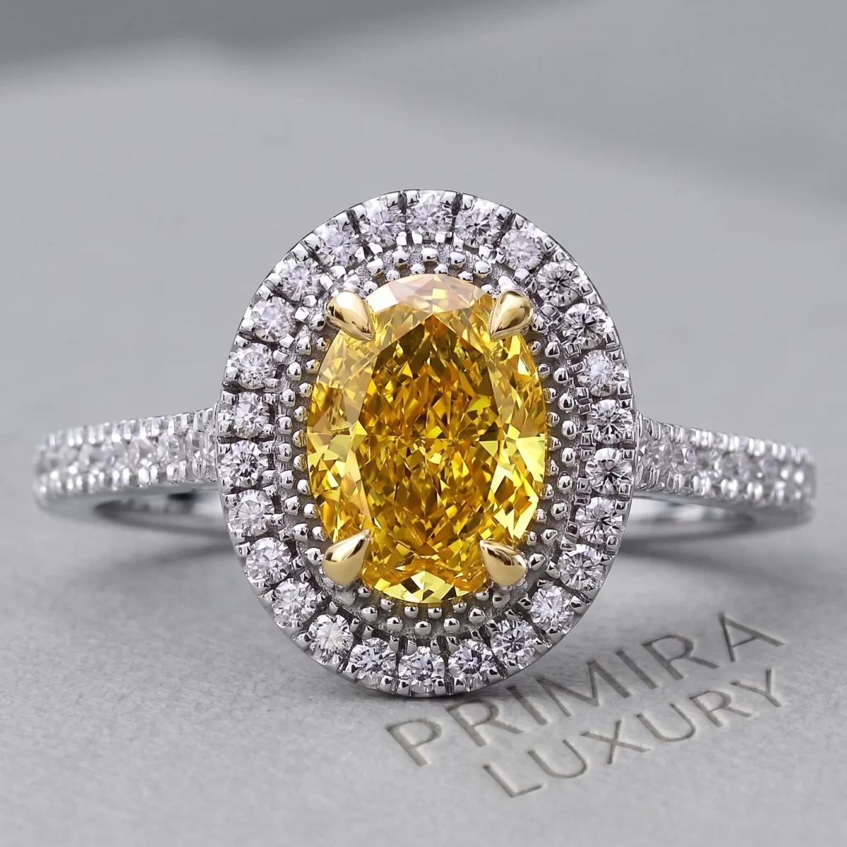 Golden Halo 1.5 Carat Oval Vivid Yellow Halo Engagement Ring Online | Primira Luxury