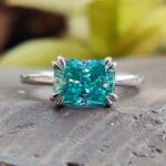 East-West 2 Carat Radiant Fancy Blue Solitaire Ring East-West Radiant Solitaire Ring – View 1