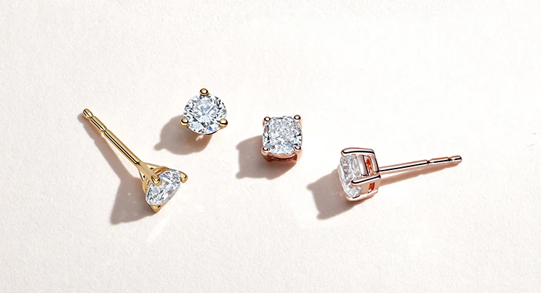 men's earrings: a luxury guide to styles, materials, and pairing 3 Men’s earrings in stud, hoop, and dangler styles displayed together