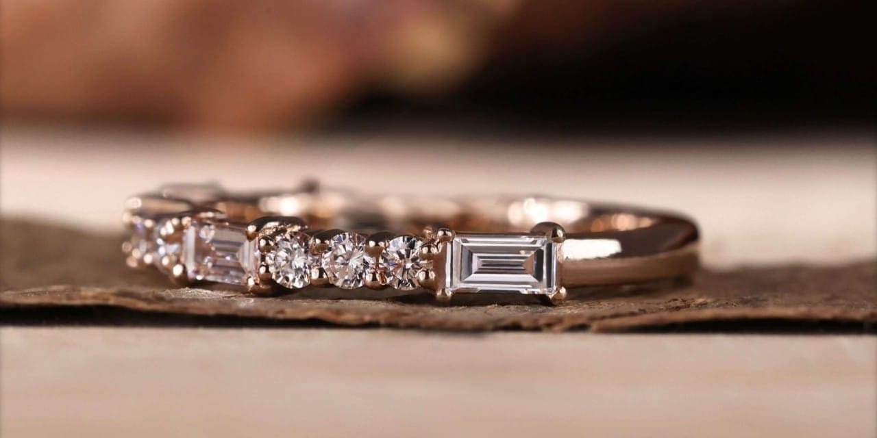 how to style an anniversary band 1 Close-up of gold anniversary band with sparkling diamonds