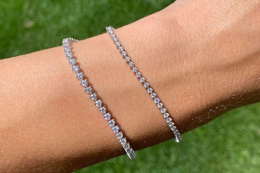 Collection of ethically-made lab grown diamond bracelets in gold and platinum.