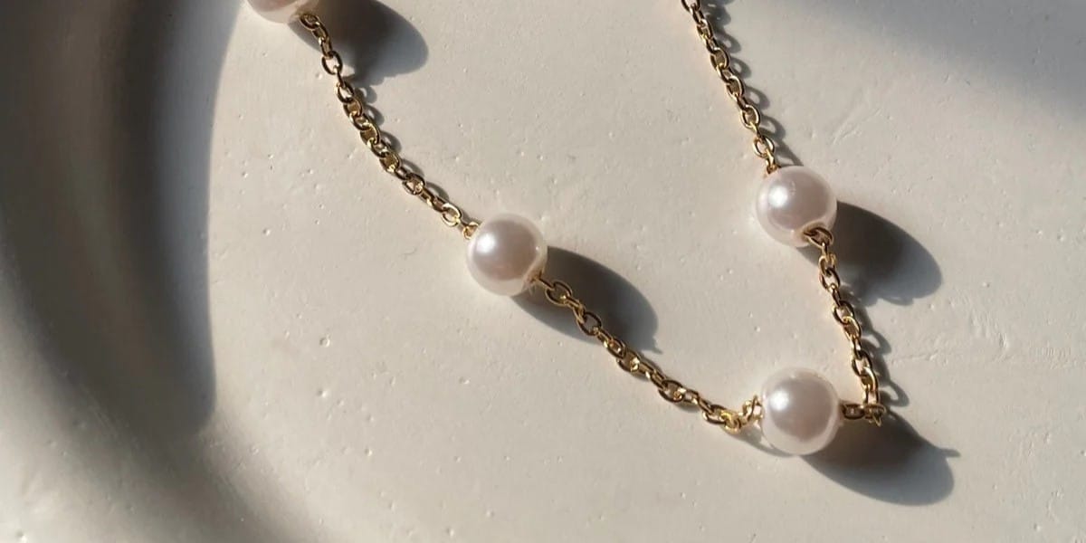 pearl necklace symbolism: history, spiritual meaning 3 Freshwater pearl choker necklace styled for modern look