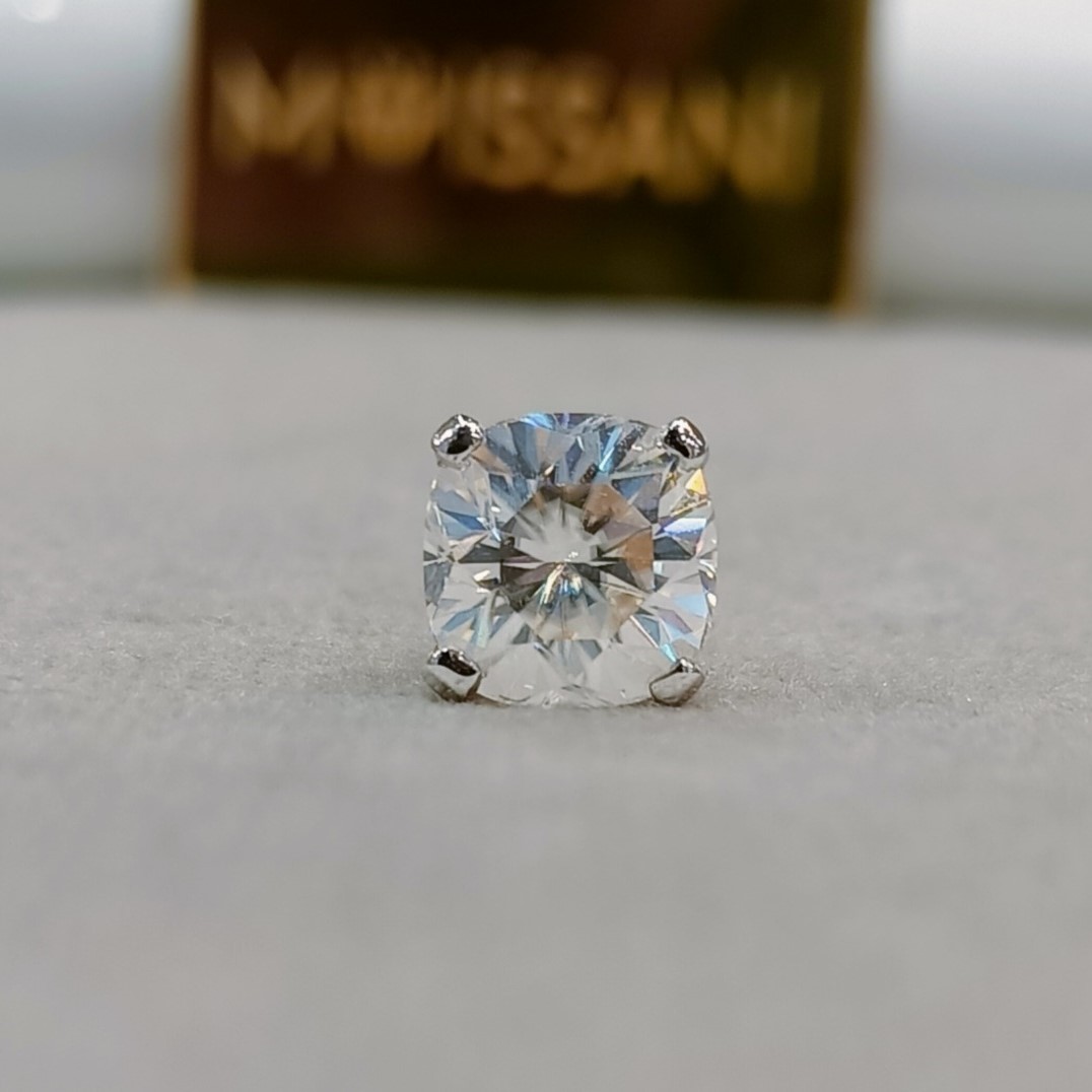 Delicate moissanite stone nose pin with a sparkling round-cut gem set in a sleek metal design