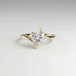 1.0 ct heart lab grown diamond asymmetric solitaire engagement ring in yellow gold with raised four-prong setting
