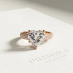 Heart cathedral pavé lab grown diamond engagement ring with 1.00 ct center stone in yellow gold.