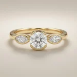 Round lab grown diamond three-stone engagement ring with marquise side stones in yellow gold, 1.0 carat center diamond design