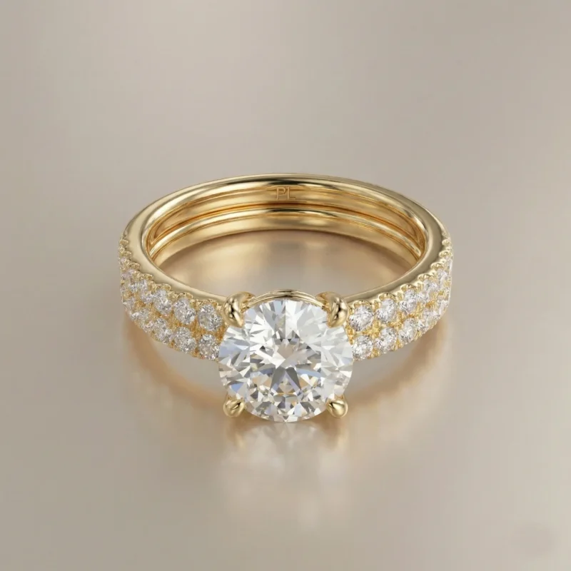 Round brilliant 1.0 carat lab grown diamond dual-band pavé engagement ring in yellow gold with elevated four-prong solitaire setting.